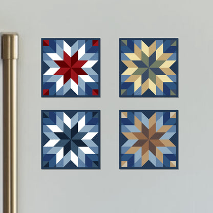 four square quilts are arranged on a wall